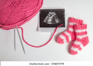 Knitting For Baby In Pregnancy And Ultrasound Picture.