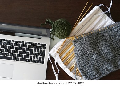 Knitting thread and needle case and laptot. Craft or knitting concept. Top view