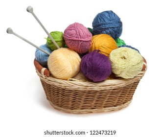 Knitting Yarn Balls And Needles In Basket On A White Background