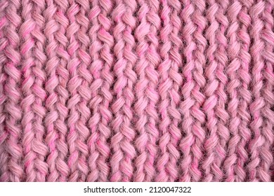 Knitwear In Calm Pink Is On The Table - This Is The Fashionable Color Trend Of 2022. View From Above. Flat Lay, Top View, Close-up, Macro, Can Be Used For Background.