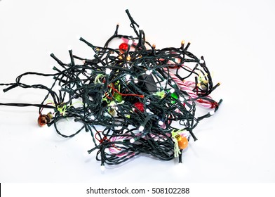 knotted christmas lights on white background