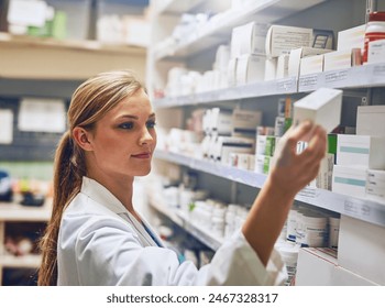 I know exactly the medication thatll help you. Shot of a pharmacist looking at medication on a shelf. - Powered by Shutterstock