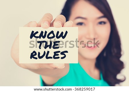 KNOW THE RULES, message on the card shown by a woman, vintage tone