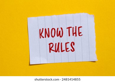 Know the rules message written on ripped torn white paper piece with yellow background. Conceptual know the rules symbol. Copy space.