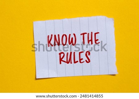 Know the rules message written on ripped torn white paper piece with yellow background. Conceptual know the rules symbol. Copy space.