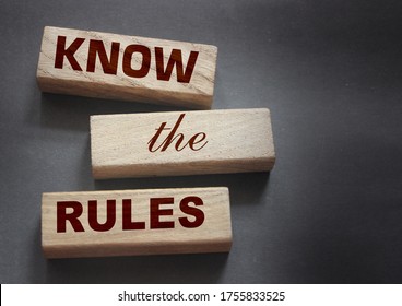 Know the rules word on wooden blocks isolated on dark grey background. business process regulation concept. - Shutterstock ID 1755833525