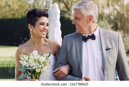 I know this is your dream come true. Cropped shot of an affectionate mature father smiling at his daughter while walking her down the while on her wedding day. - Powered by Shutterstock