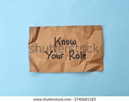 Know your role message written on crumpled brown paper. Professional boundaries, teamwork, job descriptions, and personal responsibility in a business or social concept 