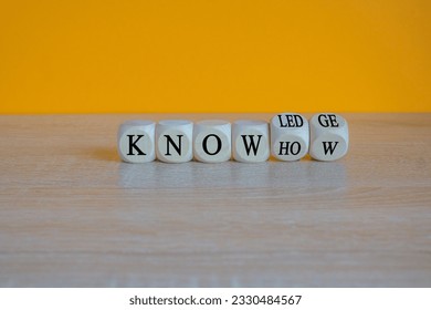 Knowledge and know-how symbol. Turned cubes, changes the word know-how to knowledge. Beautiful orange background, copy space. Business, knowledge and know-how