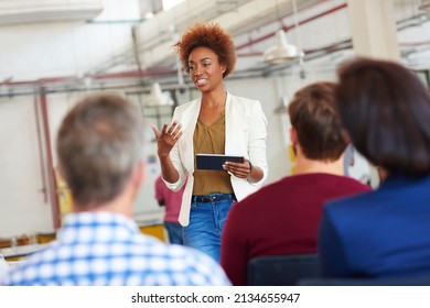 Knowledge Is Power. A Woman Giving A Presentation To Her Colleagues Using A Digital Tablet.