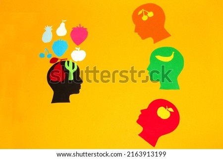 knowledge is represented by fruit, several heads learn from one head who has the most knowledge, creative concept teacher and students