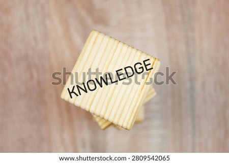 KNOWLEDGE text, word on high cubes. Acquiring knowledge, possessing a skill, knowledge, concept.
