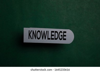 Knowledge write on a sticky note isolated on Office Desk