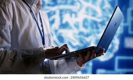 Knowledgeable executive using laptop to maintenance artificial intelligence neural networks made up of interconnected nodes. Manager oversees AI system processing information, close up