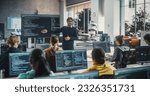 Knowledgeable Teacher Giving a Lecture About Software Engineering to a Group of Smart Diverse University Students. International Undergraduates Sitting Behind Desks with Computers