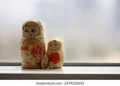 also known as stacking dolls, nesting dolls, Russian tea dolls, or Russian dolls, are a set of wooden figures of decreasing size placed one inside another.