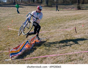 KNOXVILLE - JANUARY 22: An Unidentified Racer Leaps Over An Obstacle During The Annual Knoxiecross Cyclocross Series On January 22, 2011 In Victor Ashe Park, Knoxville, Tennessee.