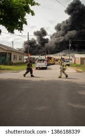 Knoxville, TN / United States -May 1, 2019: Firefighters And Police Coordinate To Fight A Fire At Fort Loudon Recycling And Waste Center In North Knoxville. 