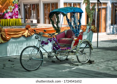 Ko Kret, Thailand 01.04.2020: Thai style vintage retro tricycle bike or rickshaw decorated and exhibited on a street market at Koh Kret island