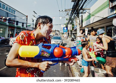 KO SAMUI, THAILAND - APRIL 13: Unidentified Man Shooting Water In A Water Fight Festival Or Songkran Festival (Thai New Year) On April 13, 2014 In Chaweng Main Road, Ko Samui Island, Thailand.