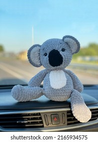 Koala Bear Sits In The Car.Soft Toy Concept.Handmade Knitted Toy.Crochet Stuffed Animals.