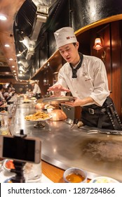 KOBE, JAPAN - DECEMBER 28, 2018 : Steak Land Kobe Kan, The Shop Features Teppanyaki. There Is A Iron Pan Around The Shop. The Seat Of Customer Beside The Iron Pan And Chef Come To Grill At The Table.