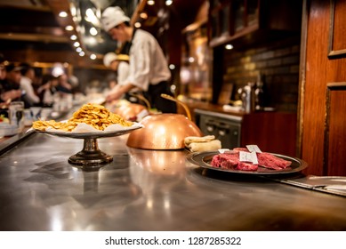 KOBE, JAPAN - DECEMBER 28, 2018 : Steak Land Kobe Kan, The Shop Features Teppanyaki. There Is A Iron Pan Around The Shop. The Seat Of Customer Beside The Iron Pan And Chef Come To Grill At The Table.