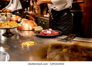 KOBE, JAPAN - DECEMBER 28, 2018 : Steak Land Kobe Kan, The Shop Features Teppanyaki. There Is A Iron Pan Around The Shop. The Seat Of Customer Beside The Iron Pan And Chef Come To Grill At The Table.