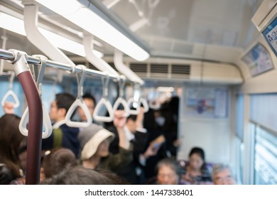 Kobe, Japan: October 11, 2018:  Passengers on a light rail train in Kobe, Japan.  Kobe has a population of 1.53 million people.   - Shutterstock ID 1447338401