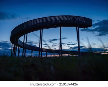 Kobyli Vrch hill with Lokout tower  South Moravia region - Czech republic. Wooden spiral construction near vineyards and church. Palava hills, famous wine area. - Shutterstock ID 2101894426