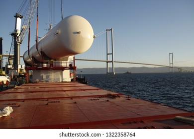 Kocaeli, Turkey - January 18, 2019: Storage tank, loading operation of project cargo with port heavy lift cranes