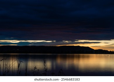 kochelsee, lake, night, nightsky, mirror, dark, clouds, rain, dramatic, sunset, afterglow, hills, tree, reed, lakeside, reflection, mood, wallpaper, orange, blue - Powered by Shutterstock