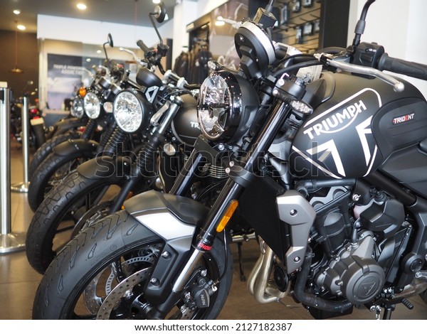 Kochi, Kerala - 1 January 2022 - Triumph\
motorcycles lined up in a showroom.\
