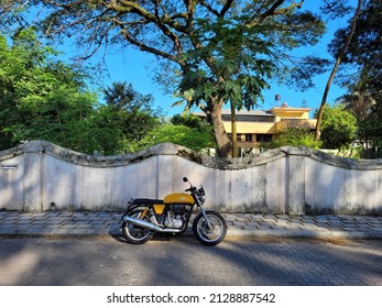 Kochi, Kerala - 7 October 2021 - A yellow Royal Enfield Continental GT 535 motorcycle in Fort Cochin.  