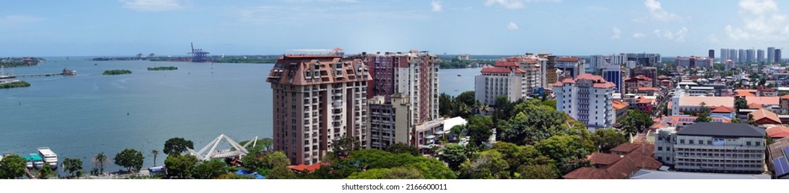 Kochi, Kerala, India, June 03, 2022: Panoramic view of Vembanad lake and buildings by the Marine drive, Kochi. Wide angle, aerial view from the top of Revenue tower.                                