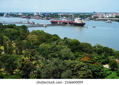 Kochi, Kerala, India, June 03, 2022: Aerial view of a container ship owned by SISL (Seven Islands Shipping Limited) in the Green Freight Corridor 2 at the Cochin port. View from Revenue Tower.