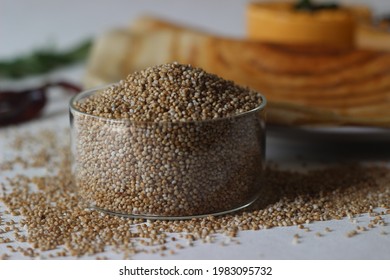 Kodo Millet, Also Known As Cow Grass, Rice Grass, Native Paspalum, Or Indian Crown Grass Is An Annual Grain Used For Cooking In Many Parts Of The World. Shot With Pancakes In The Background.