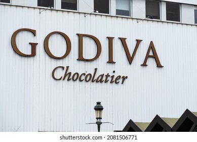 Koekelberg, Brussels Capital Region, Belgium - 11 19 2021: Facade And Sign Of The Godiva Chocolatier Chocolate Factory