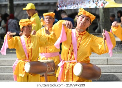 Koeln, Germany - June 25, 2022: Representatives Of Falun Gong, Also Known As Falun Dafa, A New Spiritual Practice And Movement, Demonstrate In Front Of The Cathedral Against Their Oppression In China