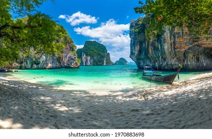Koh Lao Lading or Koh Lao Rakhing ( Lao Lading Island ) is small island offering picturesque white-sand shores and swimming coves surrounded by limestone cliffs, Krabi Thailand.