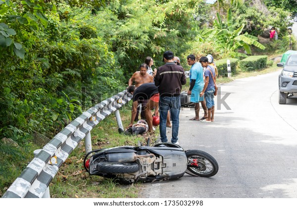 Koh\
Phangan, Thailand - february 09, 2020 : Motorcycle accident that\
happened on the road at tropical island Koh Phangan, Thailand .\
Traffic accident between a motorcycle on\
street