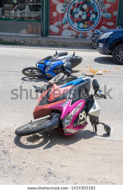 KOH
PHANGAN, THAILAND - MAY 19, 2019 : Motorcycle accident that
happened on the road at tropical island Koh Phangan, Thailand .
Traffic accident between a motorcycle on
street