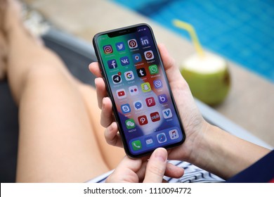 Koh Samui, Thailand - March 30, 2018: Woman hand holding iPhone X with social network on the screen. iPhone 10 was created and developed by the Apple inc.