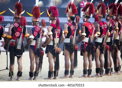 KOHIMA, NAGALAND/INDIA - DECEMBER 3, 2013: Tribesmen of Nagaland perform their traditional tribal dance at the annual Hornbill festival. The Hornbill is also known as the Festival of Festivals'.