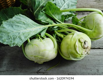    Kohlrabi cabbage on a wooden table, basket                            