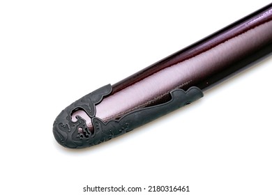 'Kojiri' is the end of the Japanese sword's scabbard or the protective fitting at the end of the scabbard. Normally made by horn but in this picture is metal. Isolated in white Background. 