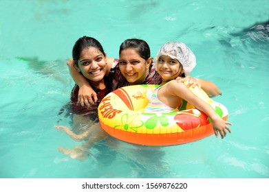 Kolad Maharashtra Mumbai India Sep. 2015 Indian Family Mother And Daughter Enjoying Swimming In Pool And Smiling 