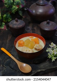 Kolak Or Indonesian Dessert For Breaking The Fast When Ramadan Month. Made From Pumpkin, Purple Sweet Potato, And Banana Cooked With Coconut Milk, Palm Sugar And Pandanus Leaves.