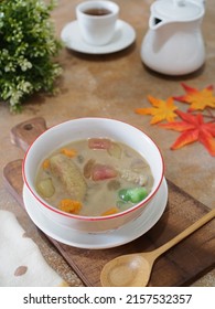 Kolak Or Indonesian Dessert For Breaking The Fast When Ramadan Month. Made From Pumpkin, Purple Sweet Potato, Sugar Palm Fruit, And Banana Cooked With Coconut Milk, Palm Sugar And Pandanus Leaves.