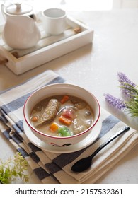 Kolak Or Indonesian Dessert For Breaking The Fast When Ramadan Month. Made From Pumpkin, Purple Sweet Potato, Sugar Palm Fruit, And Banana Cooked With Coconut Milk, Palm Sugar And Pandanus Leaves.